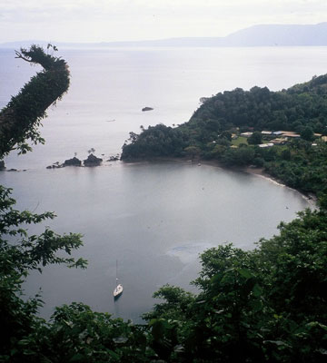 Lolowai, the only harbor on Ambae, was created in a massive explosion, when the magma chamber below opened to the sea above. A coral reef at the entrance prevents all but small yachts from entering. Photo: Toulmin