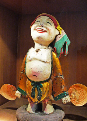 With his rod removed, this jolly fellow stands in a puppetry display case in the Museum of Ethnology, Hanoi.