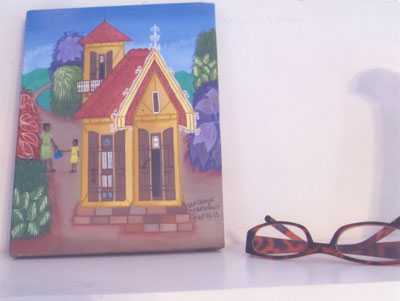“Enchante,” a painting of a typical “gingerbread house” in Haiti. Photo: Baffa