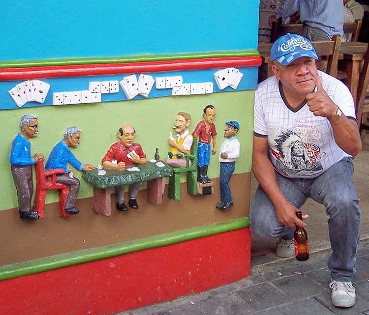 A Guatapé local poses by a pub-front “socket” for which he served as a model. Photos: Keck
