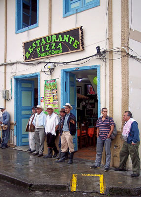 Locals outside of a restaurant in Salento, in Cocora Valley in the department of Quindío.