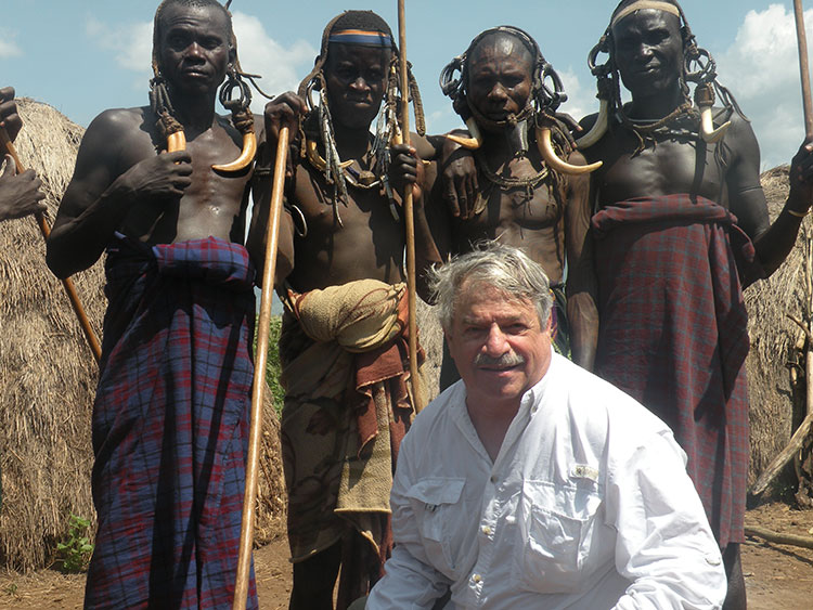 Larry Kritcher with members of the Mursi tribe.