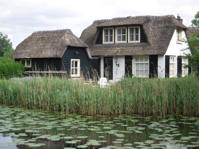 A thatch-roofed house on a lake near Ankeveen.