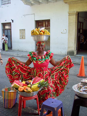 A fruit vendor in traditional costume in the walled city of Cartagena. Photos: Keck