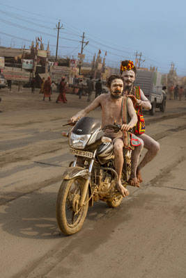 Two sadhus racing up the street on a motorcycle made for a remarkable sight.