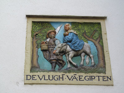 Next to Het Houton Huys in the Begijnhof are plaques depicting biblical themes, including this one on the 