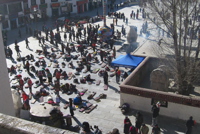 Pilgrims in Barkhor Square in Lhasa, Tibet. Photo by Florence Drake