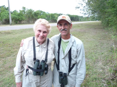 Linda Beuret with a local Cuban guide wearing one of the caps she brought.