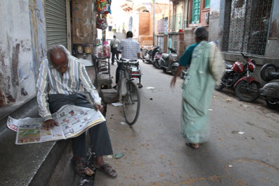 Experimenting with slow camera shutter speeds in Jodhpur to blur the movement of a passerby.