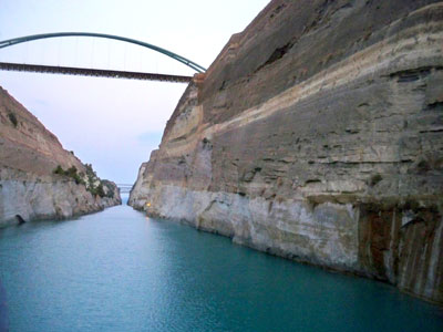 A motor bridge spans the Corinth Canal’s nearly 300-foot-high limestone walls about halfway through the transit. Photo: Bowman