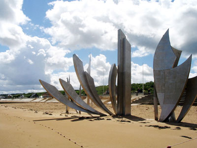 This June marks the 70th anniversary of D-Day, commemorated by the sculpture “Les Braves,” by Anilore Banon, honoring the soldiers who landed on Omaha Beach in Normandy, France. Photo by Robyn Stencil