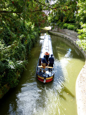 An excursion boat making its way through the Sydney Gardens on the Kennet and Avon Canal.