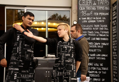 A waitress and waiter at one of Barcelona’s tapas restaurants discussing who needs a menu. Photo by Margaret Mallory