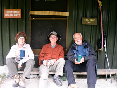 Backbackers (left to right) Lynne Eastman, Frank Cunningham and Garry Eastman at a Milford Track shelter.