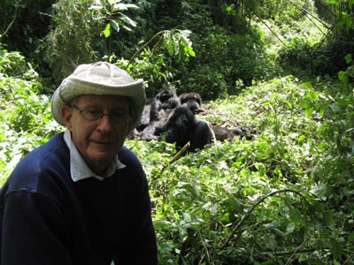 Marvin Silverman with a group of mountain gorillas. This picture was taken by the ranger in charge of the trekking group.