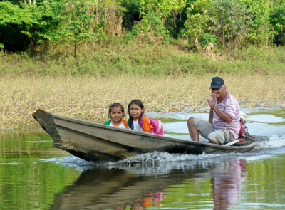Along the Rio Negro, these village children were on their way to school. Photo by Randy Keck
