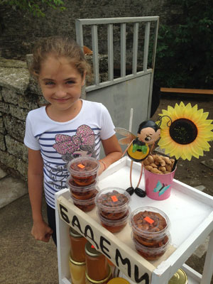 Who could turn down this sweetheart in Bulgaria selling almonds soaked in honey?