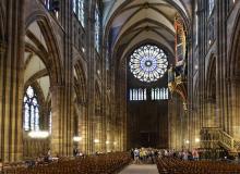 The interior of Strasbourg’s cathedral includes an elaborately carved stone pulpit from the 1400s (lower right) and an exquisite gold-leafed organ (upper right).