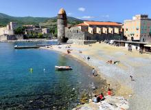 Collioure’s sand-and-pebble beach ends at the Notre-Dame des Anges church, a view that has inspired many modern artists. Photo by Cameron Hewitt