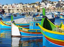 According to tradition, the colors of these Maltese fishing boats represent a fisherman’s home village. Photo by Gretchen Strauch