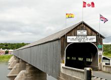 The Hartland Covered Bridge, built in 1901 and covered in 1921, is the world’s longest covered bridge, stretching 1,282 feet over the Saint John River in New Brunswick, Canada.