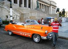 Many visitors equate Cuba with vintage American cars, which were brought to the island before Fidel Castro seized power in 1959. Many, like this one, are used as taxis. Photo by Tom Auciello