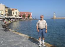 Marvin Feldman on the promenade at the Old Venetian Harbor in Chania, Crete. Photo by Carole Feldman