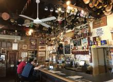 Hats and caps cover the rafters in the Birdsville Hotel pub, a welcome watering hole for visitors and locals — Birdsville, Queensland. Photos by David Bentley