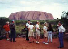 Uluru, aka Ayers Rock, a sandstone monolith in Australia’s Northern Territory, draws many a tour group. Photo by Gail Keck