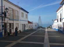 Painters whitewashing in traditional style in Porto Côvo, Portugal. Photos by Randy Keck