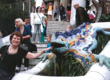 Arlene Lichtenstein tempting the Gaudí lizard in Parc Güell — Barcelona.