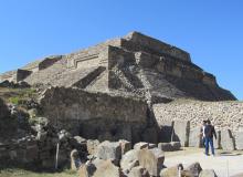 Danzantes, with Building M in the background — Monte Albán, southern Mexico. Photos by Julie Skurdenis