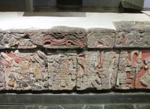 Stone banquette with carvings of warriors and priests — Templo Mayor Museum, Mexico City. Photos by Julie Skurdenis