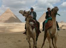 Riding camels to the Great Pyramids.