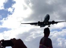 Planes are so close, you can almost get a free flight just by grabbing the tail — Sint Maarten.  Photos by Miyako Storch