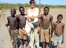 Suzi Colman shows off the flamingo found on her outing with the Hadza huntsmen.