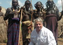 Larry Kritcher with members of the Mursi tribe.