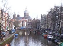 A view of a typical Amsterdam canal looking toward St. Nicholas Church.