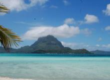 Bora Bora with the famous Mt. Otemanu covered by a cloud.