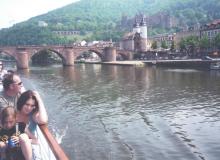 From the river, a view of the Old Bridge and castle in Heidelberg.