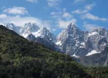 The road leading toward Mt. Vršič Pass offers dramatic alpine scenery.