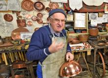 A coppersmith in Montepulciano, Italy. Photo by Cameron Hewitt