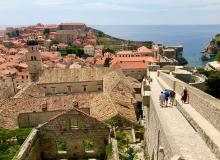 Strolling atop the wall overlooking Dubrovnik. Photo by Trish Feaster