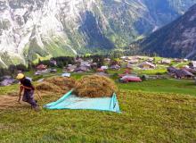 A farmer loads up his tarp for a hayride directly to the barn. Photo by Rick Steves