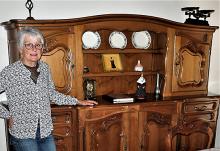 Estelle Alcaraz by an heirloom credenza at the farmhouse in Pernes-lesFontaines. Photos by Victor Block