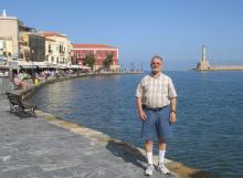 Marvin Feldman on the promenade at the Old Venetian Harbor in Chania, Crete. Photo by Carole Feldman