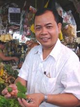 At a wet market in Phnom Penh, chef San Sinith explained the qualities of various herbs. Photos by Sandra Scott