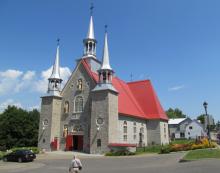 Èglise Sainte-Famille stands proudly with three bell towers — Île d’Orléans, eastern Canada. Photos by Julie Skurdenis