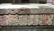 Stone banquette with carvings of warriors and priests — Templo Mayor Museum, Mexico City. Photos by Julie Skurdenis