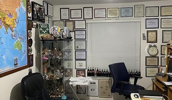 Leon Hochman's travel room, with a world map, his <b><i>ITN</i></b> Travel Awards and souvenirs of his travels.